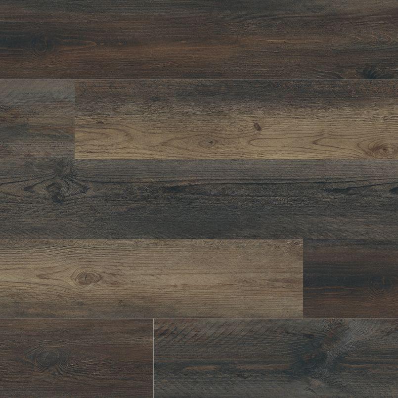 Flat lay of Stable luxury vinyl tile in warm antique brown tones with woodgrain pattern