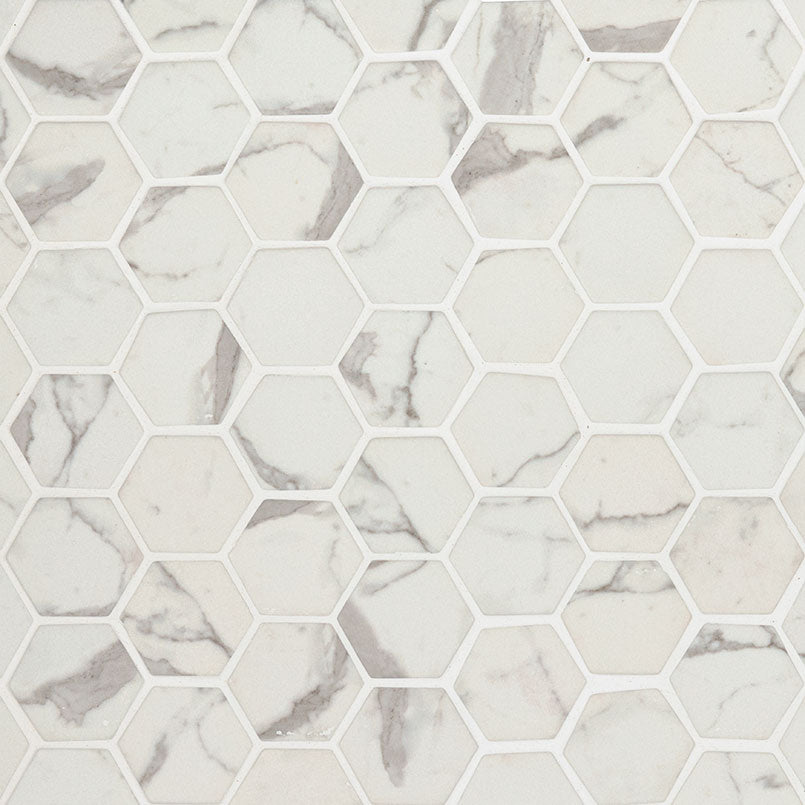 Flat lay of Statuario Celano Hexagon Mosaic with 2-inch recycled glass tiles in white and gray