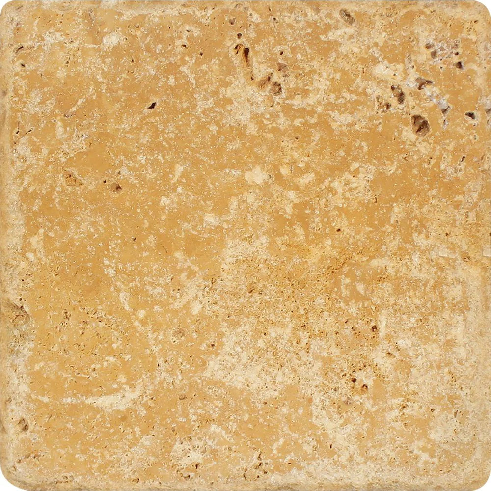 Close-up of Tuscany Gold Travertine tile with tumbled edge and textured surface