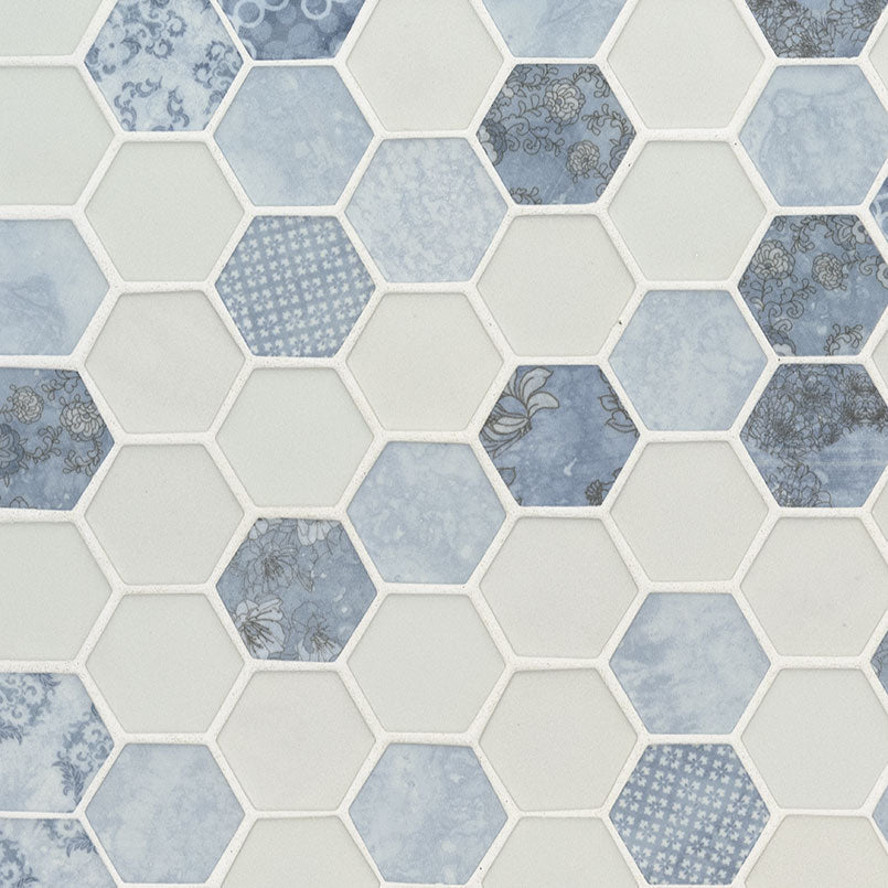 Flat lay of Vista Azul Hexagon Mosaic showing blue and white patterned recycled glass hex tiles