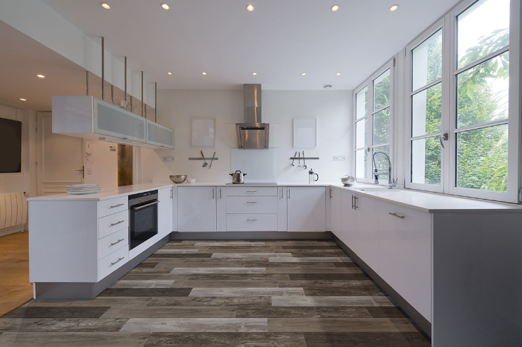 Close-up of Weathered Brina vinyl plank surface highlighting wood grain knots and matte finish