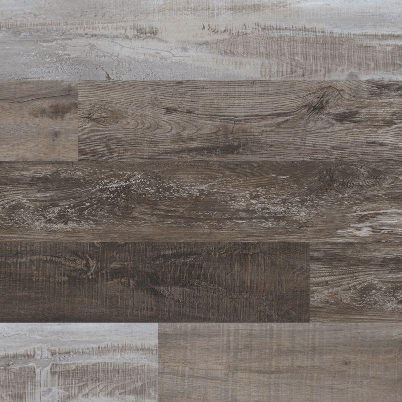 Flat lay of Weathered Brina LVT showing aged brown tones and natural wood texture