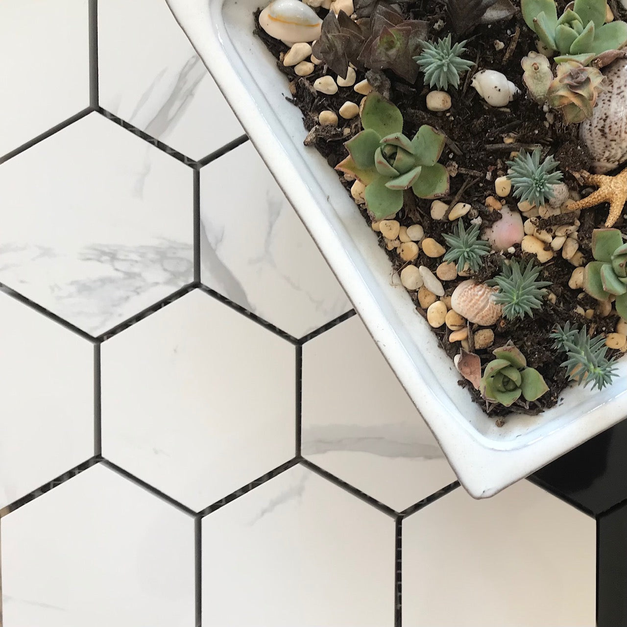 Floor installation featuring porcelain mosaic in hexagon style