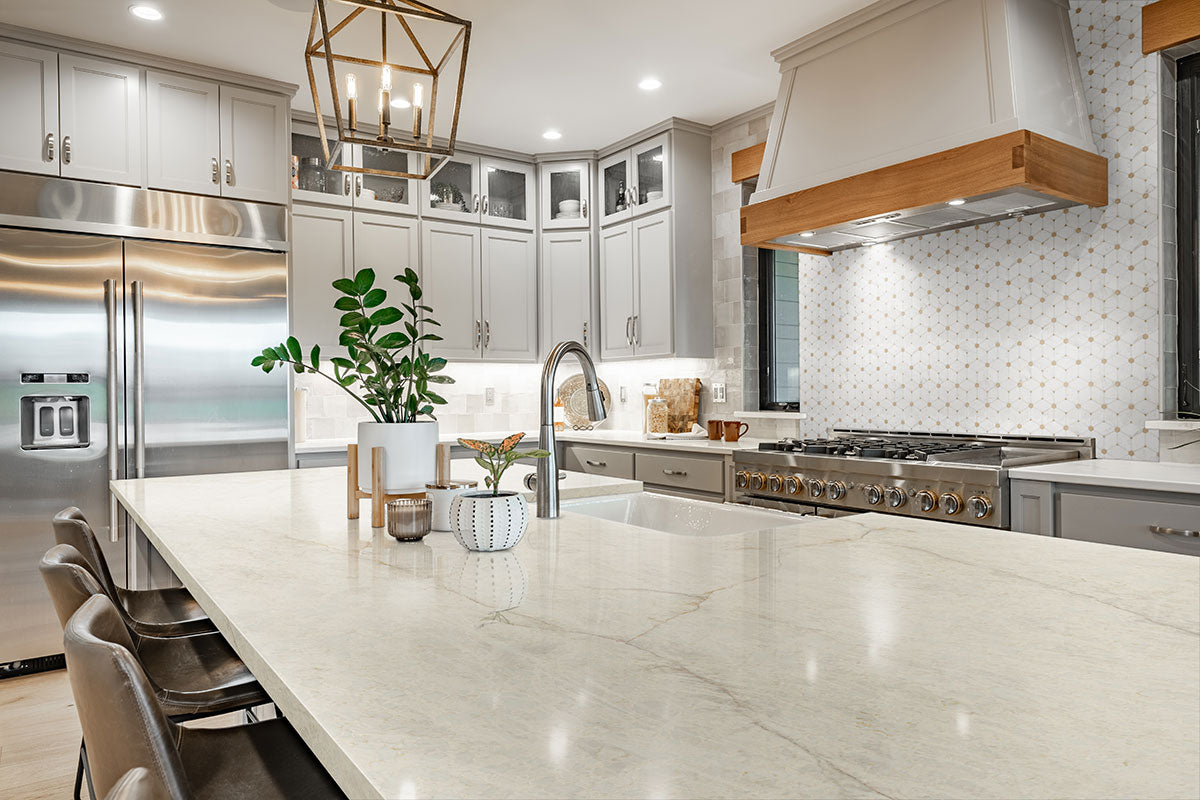 Marble tile installed on kitchen wall with luxurious polished finish