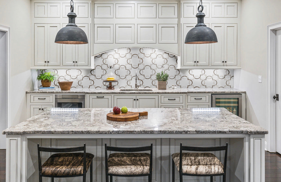 Installed view of marble waterjet mosaic tile in a modern kitchen wall