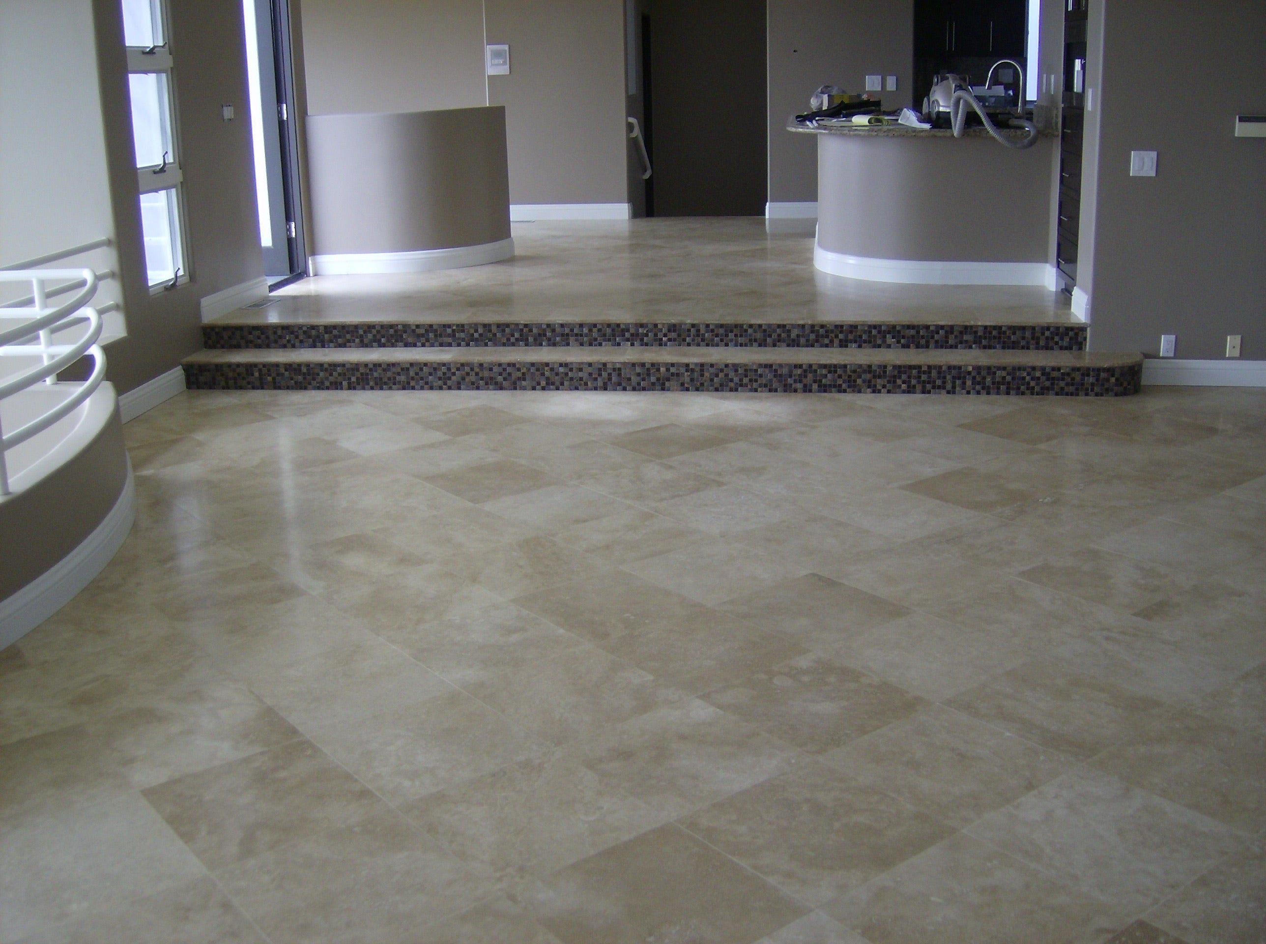 nstalled Durango Travertine tiles showing tan and cream swirls in a honed finish