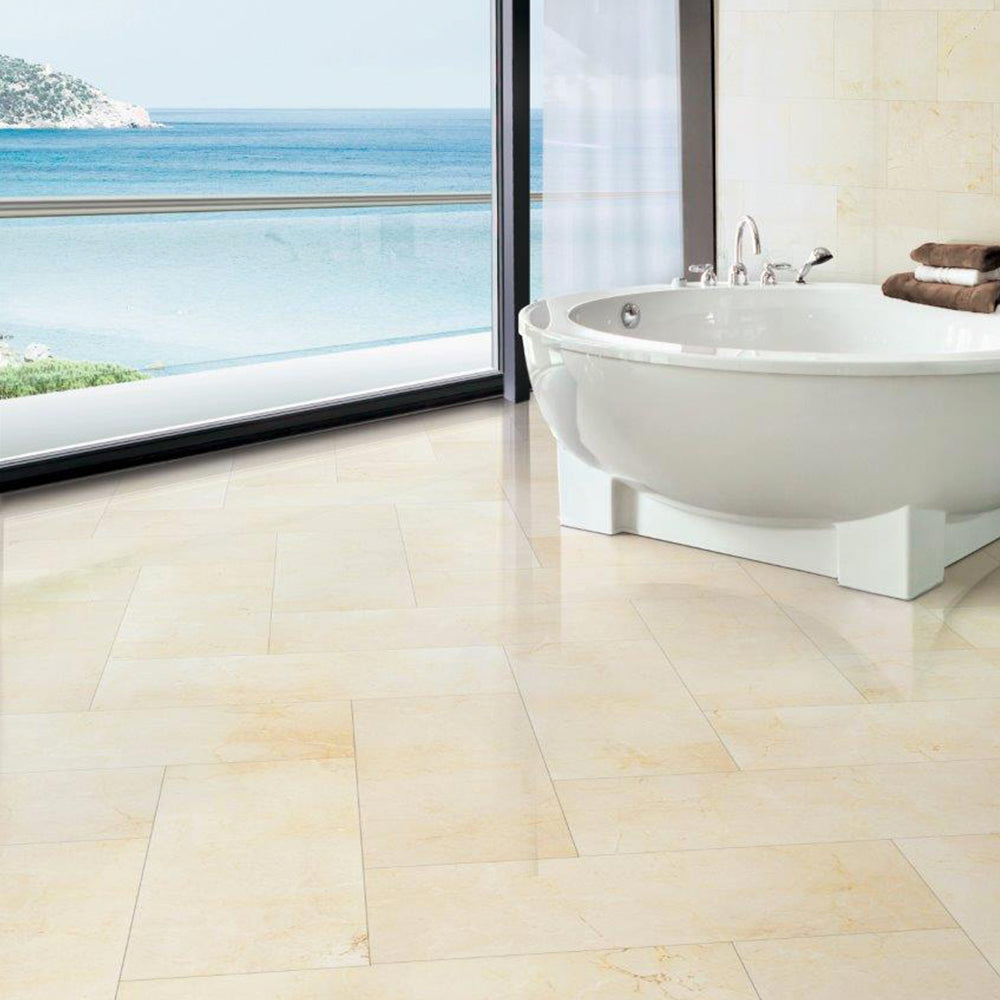 Crema Marfil marble tiles in warm beige tones with subtle gold veining