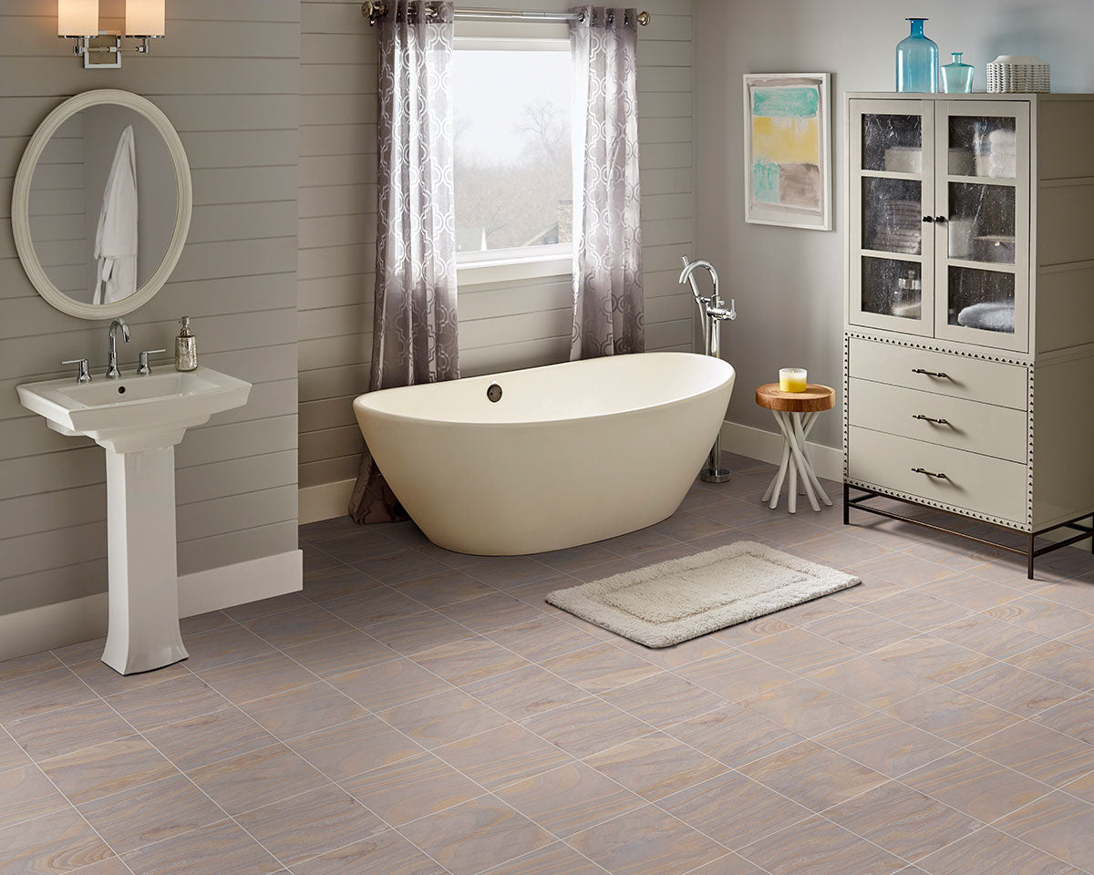 Natural sandstone tile and pavers in mixed warm tones, featuring textured surface and soft earth colors