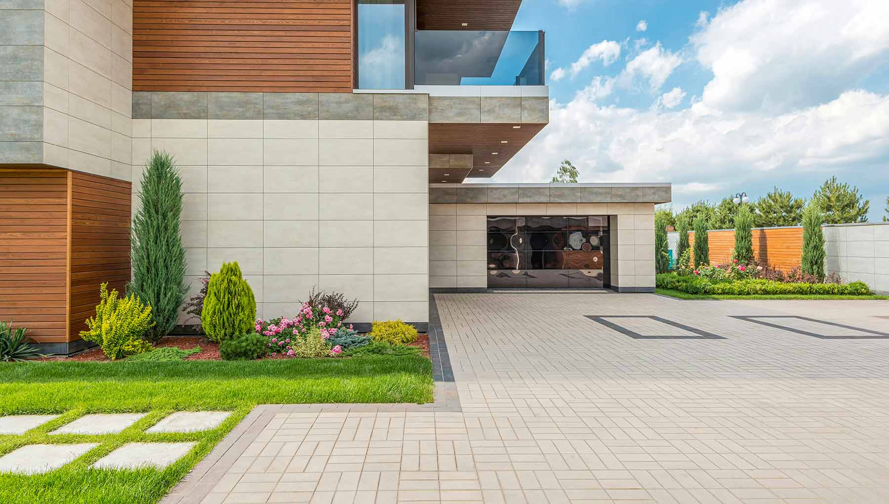 Natural stone pavers and tiles installed on outdoor patio featuring warm tones and textured finishes