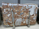 Flat view of Red Fusion Marble Slab in polished finish showing red, gray, and ivory brecciated pattern
