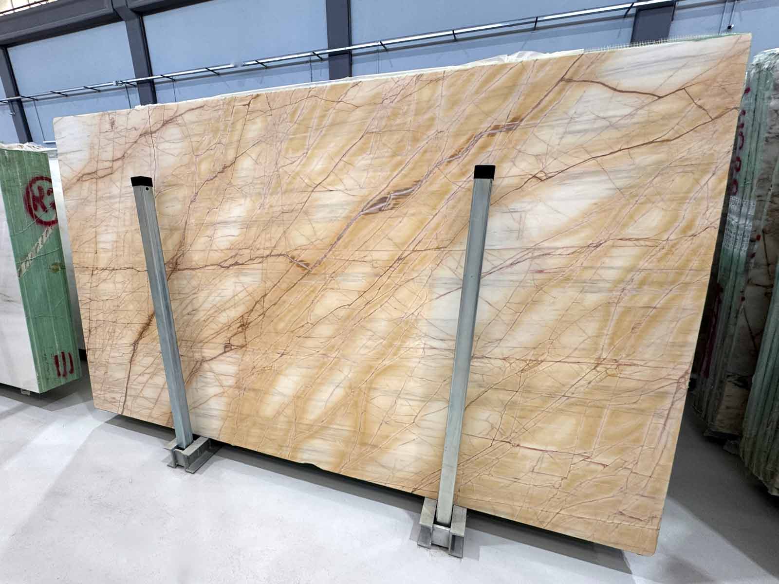 Sunrise Silk Marble Slab in polished finish showing ivory, gold, and pink veining