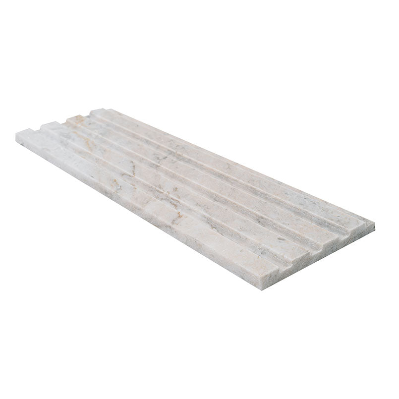 Edge of Arabescato Venato marble showing linear fluted design and soft veining