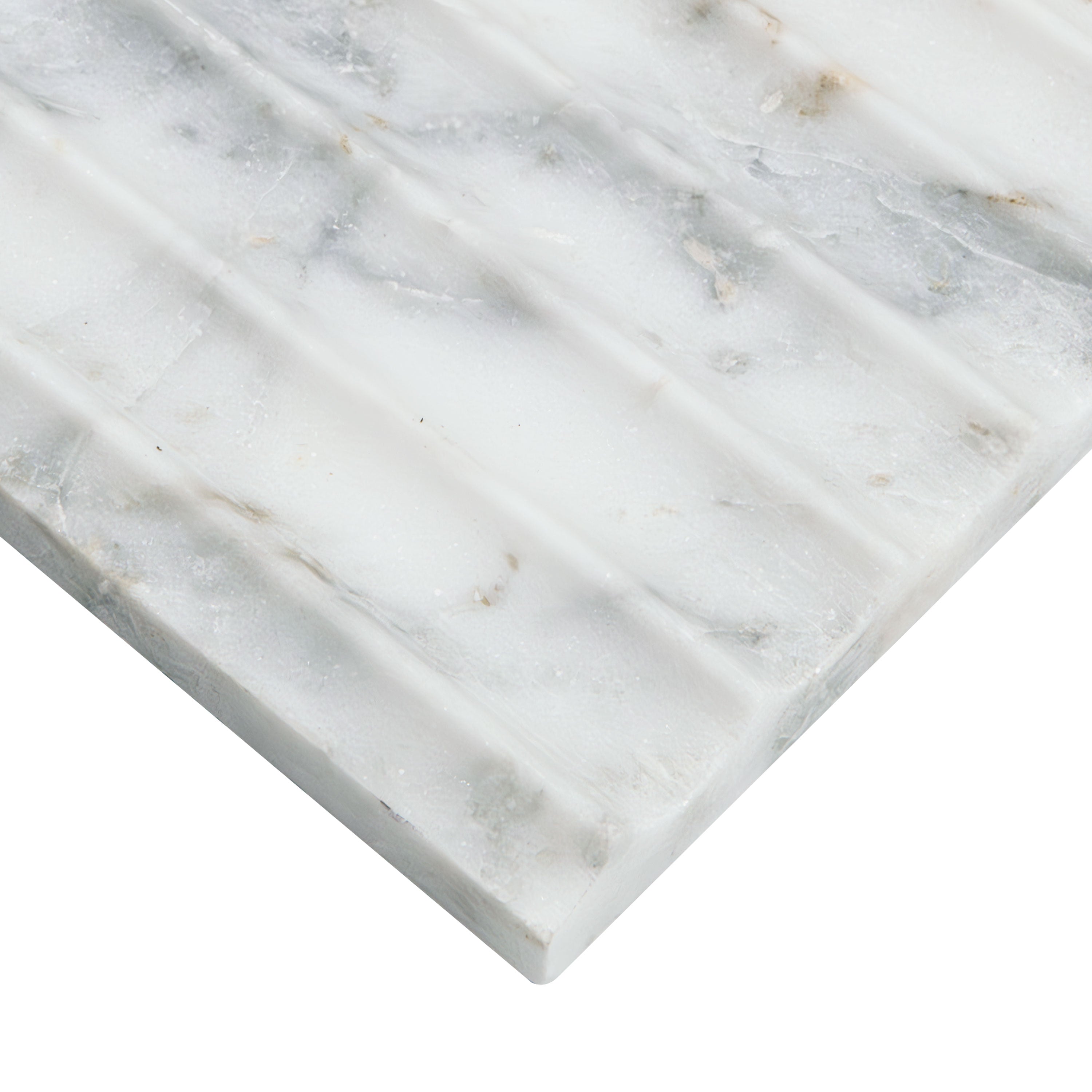 Edge of inverted fluted design on Arabescato Venato Valentino Fluto Marble Tile