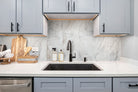 Arabescato Venato Valentino Fluto tile was installed on a kitchen wall