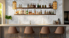 Installed view of Arabescato Venato Valentino Fluto tile on a restaurant wall.