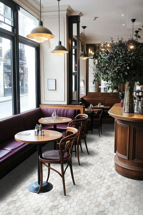 Arabescato Venato White hexagon tile installed on a restaurant floor.