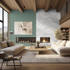 Arctic White XL Quartzite Panels installed on a fireplace wall with bright, layered texture