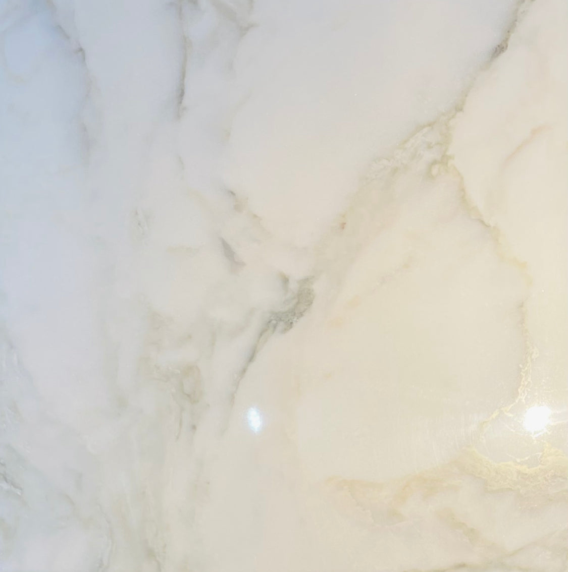 Close-up of Calacatta 18x18 Marble Tile highlighting polished surface and natural veining