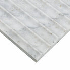 Edge of Capri Blue marble showing inverted fluted surface and soft gray-blue veining
