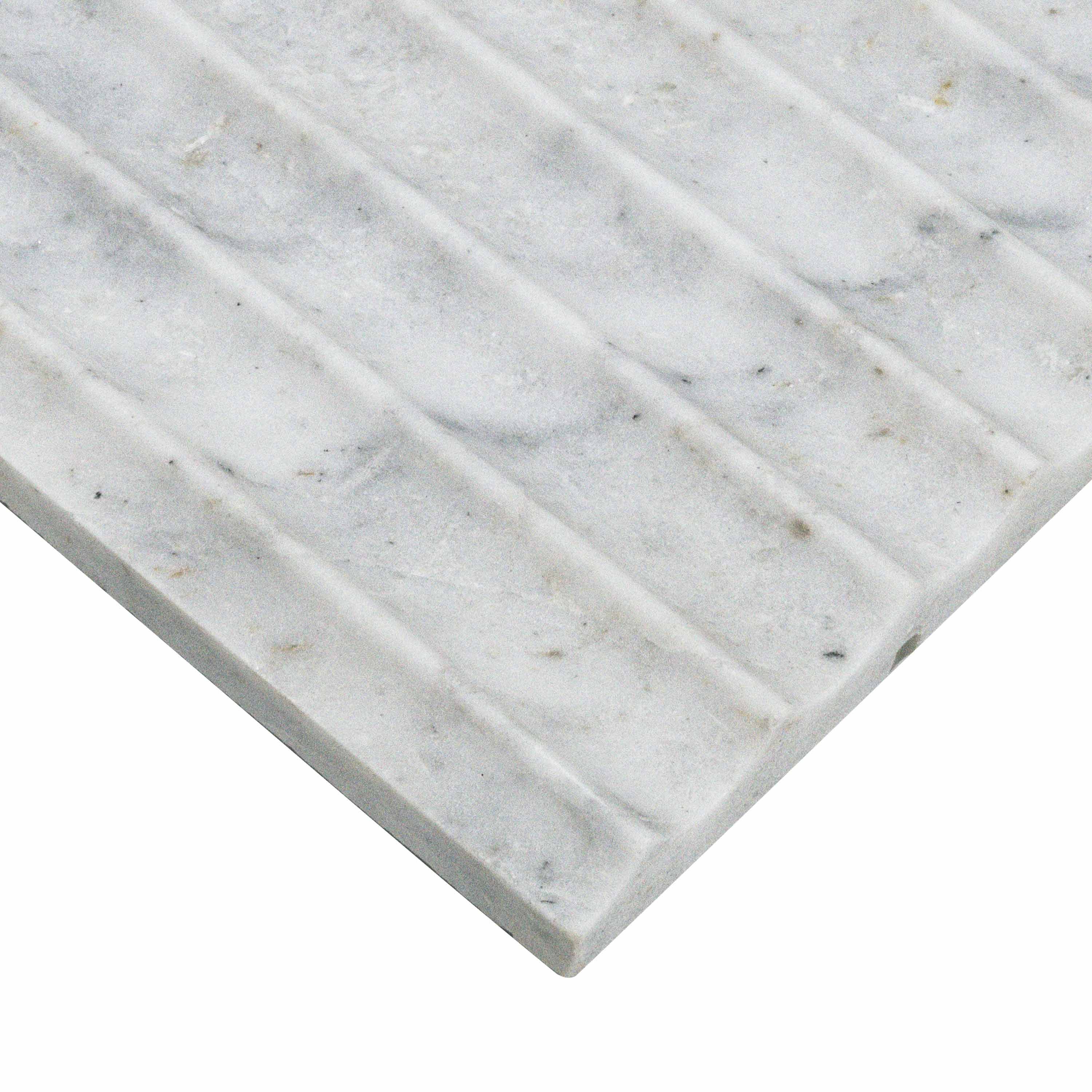 Edge of Capri Blue marble showing inverted fluted surface and soft gray-blue veining