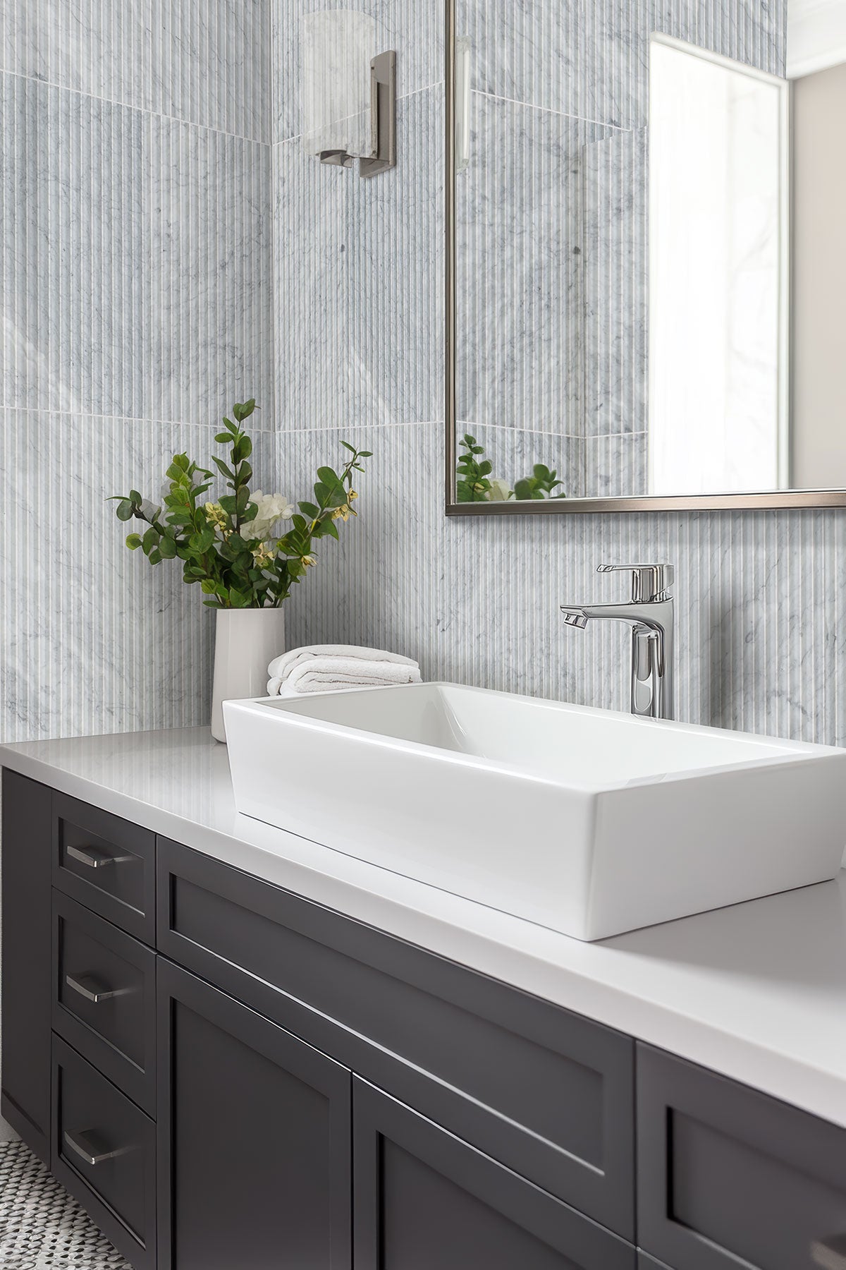 Carrara White Valentino Fluto Marble Tiles installed on bathroom accent wall with honed finish