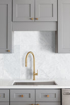 Carrara White Valentino Fluto Marble Tiles installed on kitchen wall with honed finish