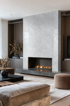 Carrara White Valentino Fluto Marble Tiles installed on fireplace accent wall with honed finish
