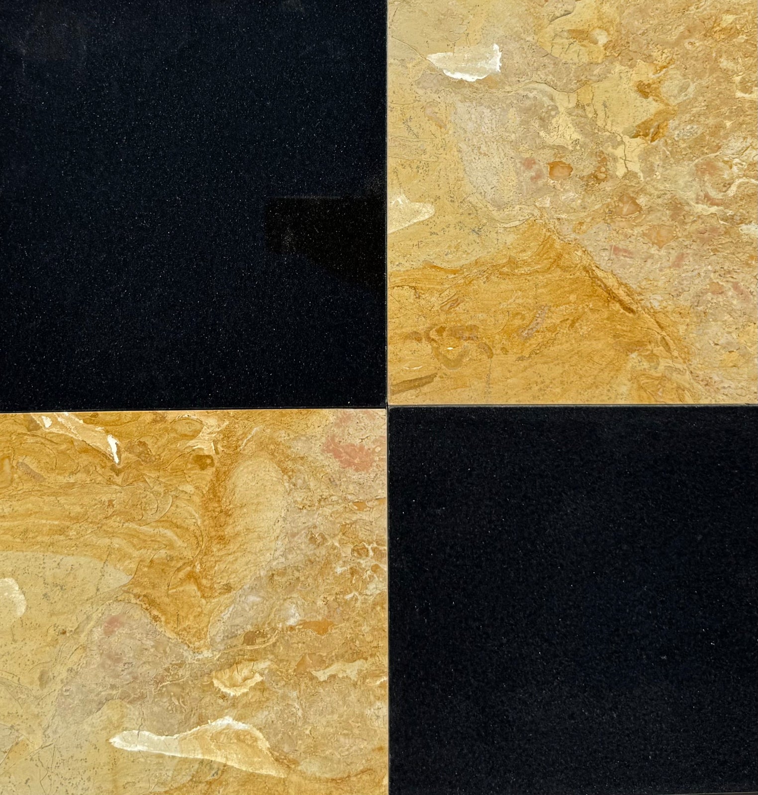Close-up of checkerboard marble tile with white Calacatta and golden Giallo Reale finish