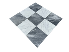 Close-up of Checkerboard Carrara and Bardiglio Marble tile showing contrast and fine marble veining