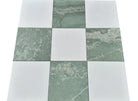 Close-up showing the texture of Ming Green and Thassos marble in checkerboard design