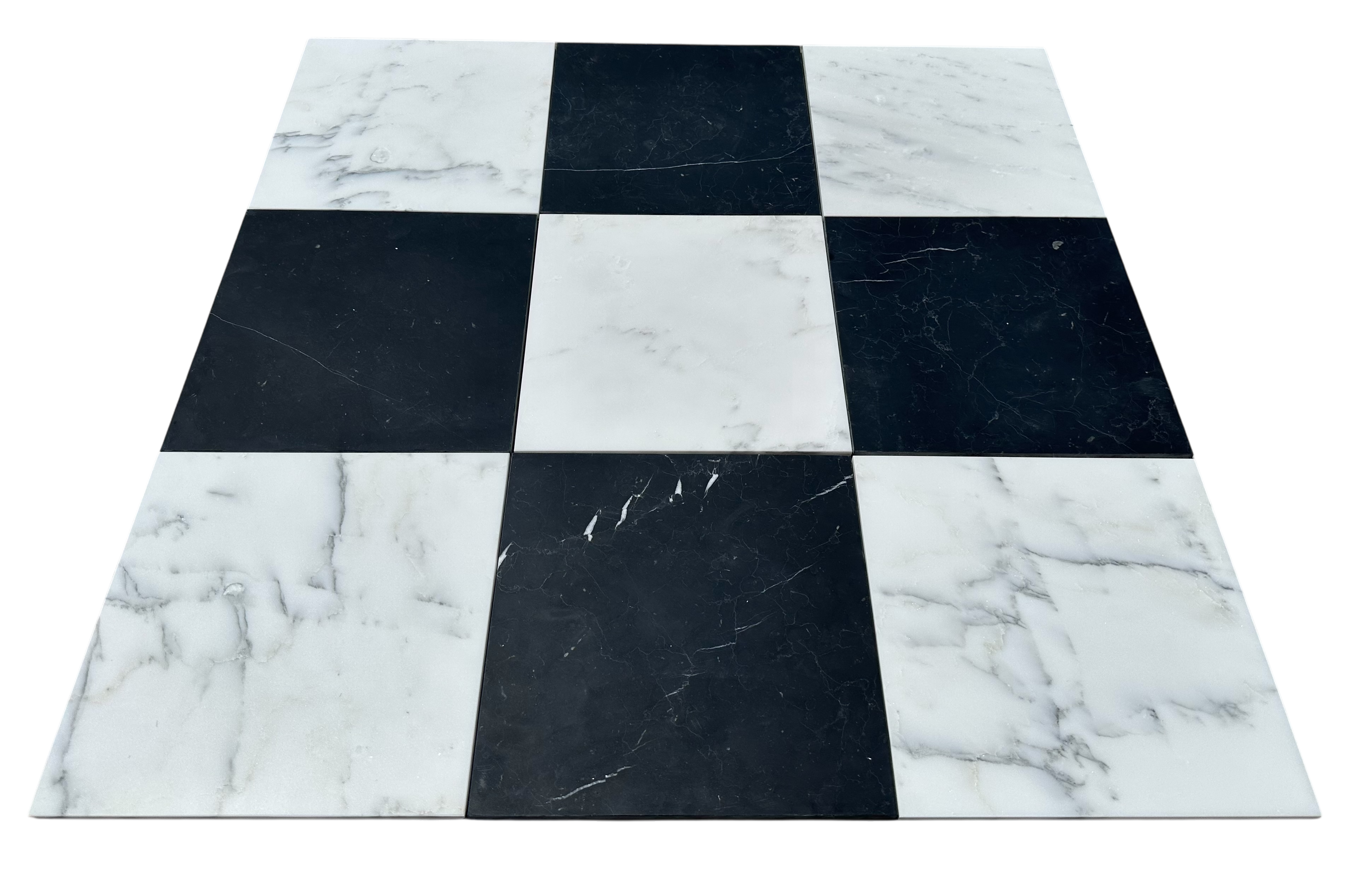 Close-up of Statuary and Nero Marquina checkerboard marble showing natural veining and polished contrast