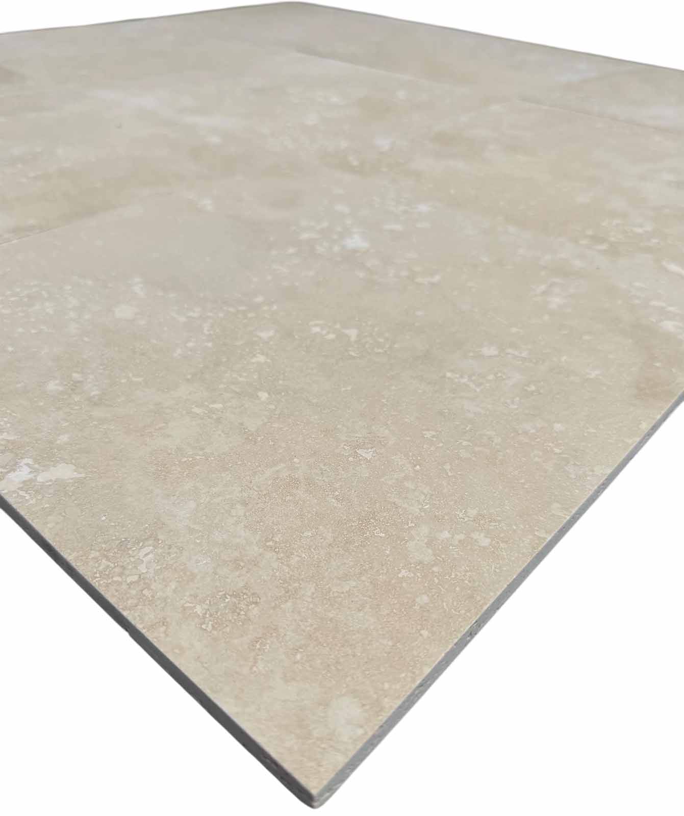 Close-up of Ivory Light Travertine 12x12 Honed Filled Tile showing matte finish and natural stone details