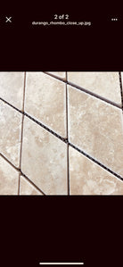 Close-up of rhomboid travertine showing tumbled finish and warm tones