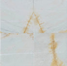 Close-up of Giallo Crystal marble surface showing polished texture and natural golden veining