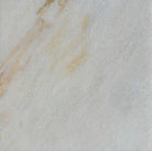 Sample swatch of Giallo Crystal marble tile, cut from actual lot