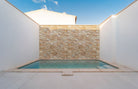 Golden White XL Quartzite Panels installed on exterior pool wall surround with bold contrast and rustic charm