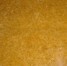 Close-up of Inca Gold Marble 18x18 tile showing warm golden veining on polished surface