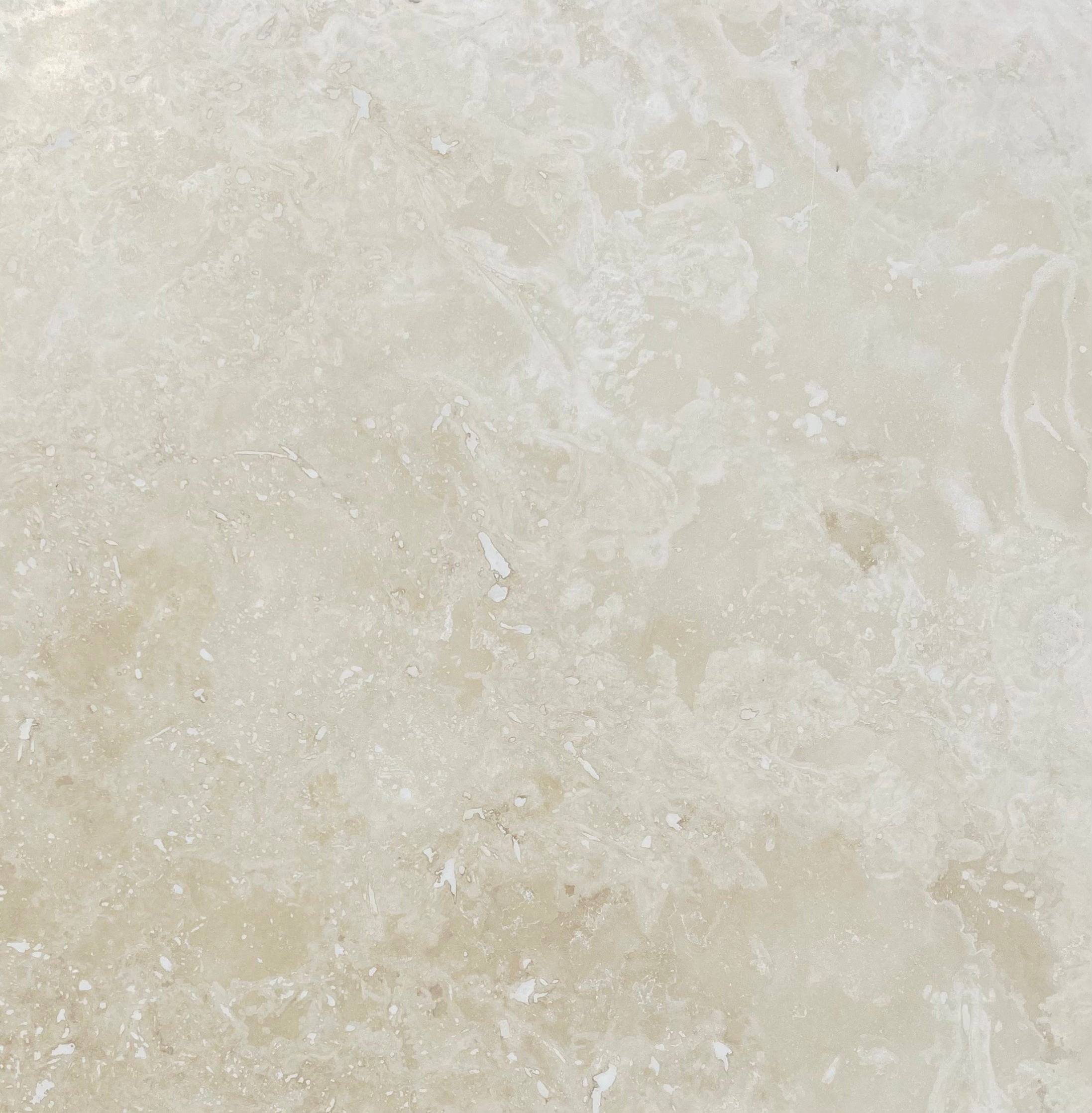 Flat view of Ivory Travertine 12x12 Honed Tile in soft matte finish
