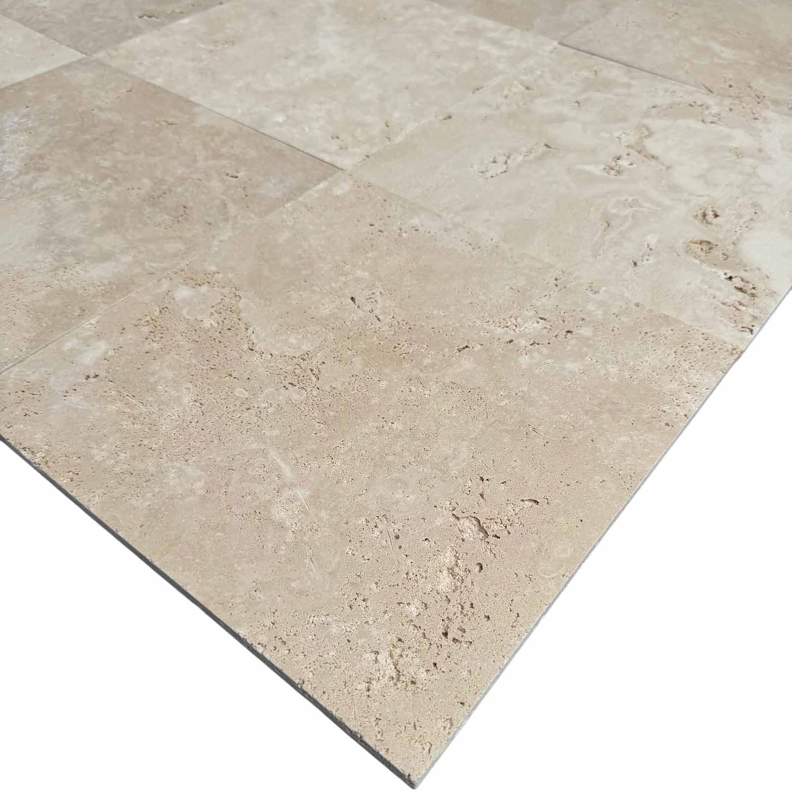 Close-up of Ivory Travertine 12x12 Honed Tile showing matte finish and natural texture
