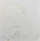Close-up of Ivory Travertine 18x18 tile showing honed surface and natural variation