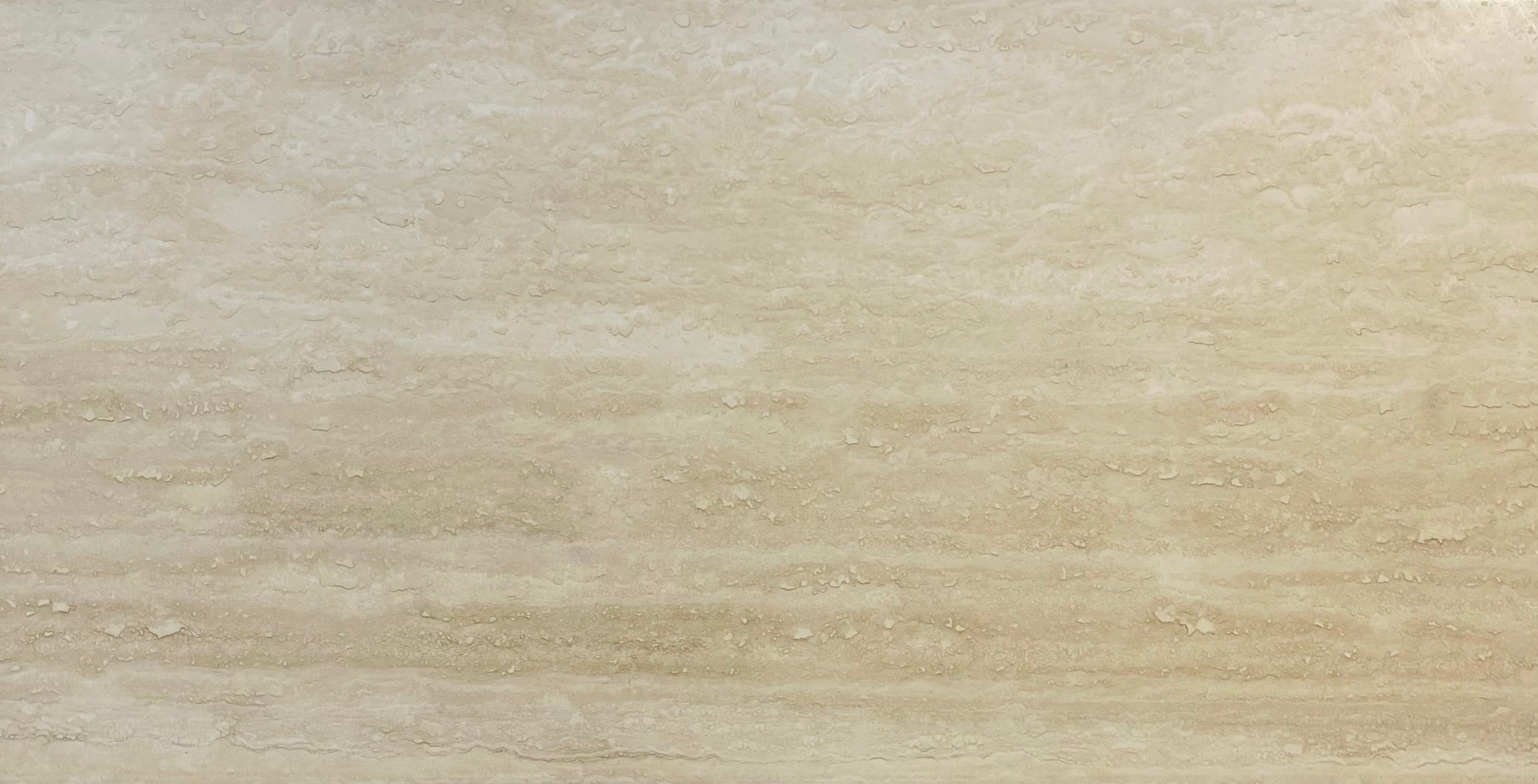 Close-up of Ivory Vein Cut Travertine showing horizontal striations and smooth finish