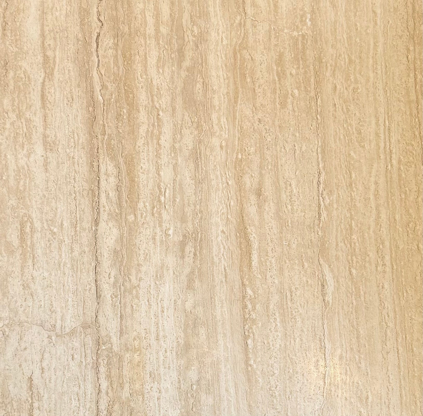Ivory Vein-Cut Travertine Tile 24x24 with honed and filled finish in natural cream tones