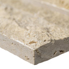 Close-up of Roman Beige Travertine showing beige and cream tones with natural split texture