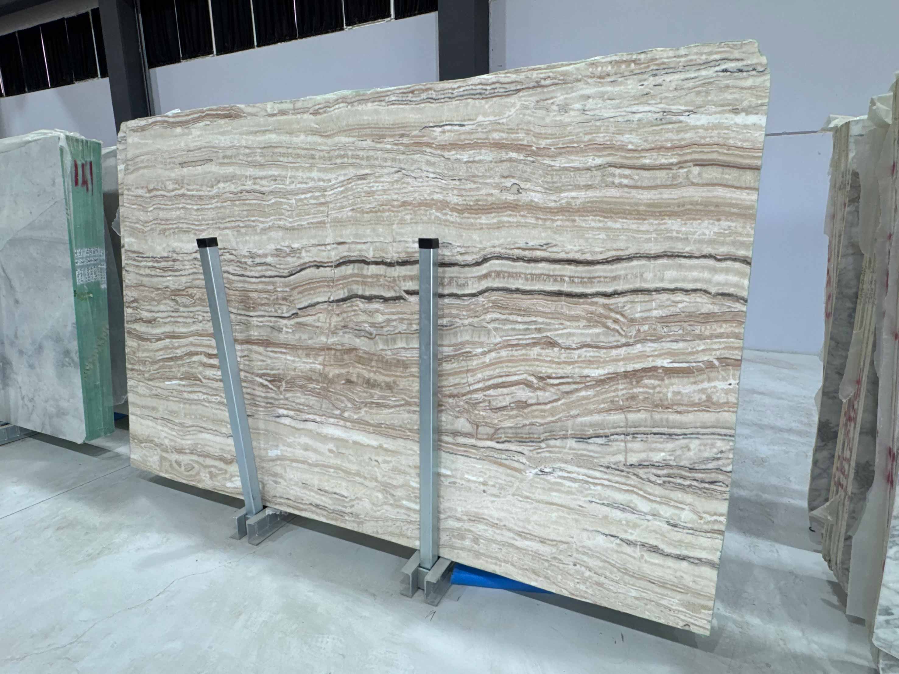 Sand Drift Marble Slab showing layered texture and matte honed surface