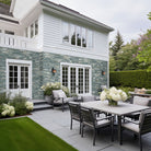 Sierra Blue XL Quartzite Panels installed on exterior wall with rustic multitone finish