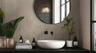 Sinfonia Piano Abedul Fluted Tiles installed on bathroom wall with seamless vertical layout