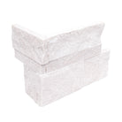 Flat view of XL Rockmount Arctic White 9x18 Corner with split-face quartzite surface in bright white tones