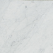 Close-up of Carrara White Marble tile showing soft gray veining on white background