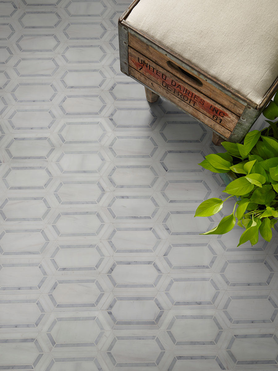 Close-up view showing polished marble texture and fine picket waterjet design