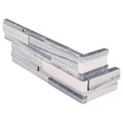 Overhead view of Alaska Gray 3D Honed marble corner panels in clean white and gray tones